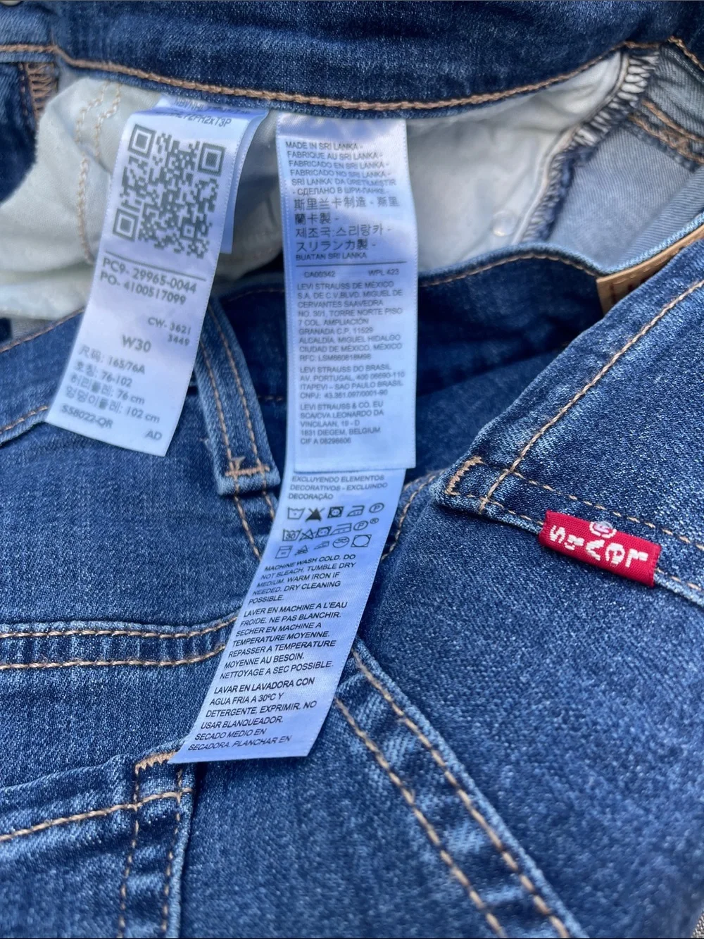 LEVI’S Mid-Length/Mid-Rise Distressed Denim Shorts